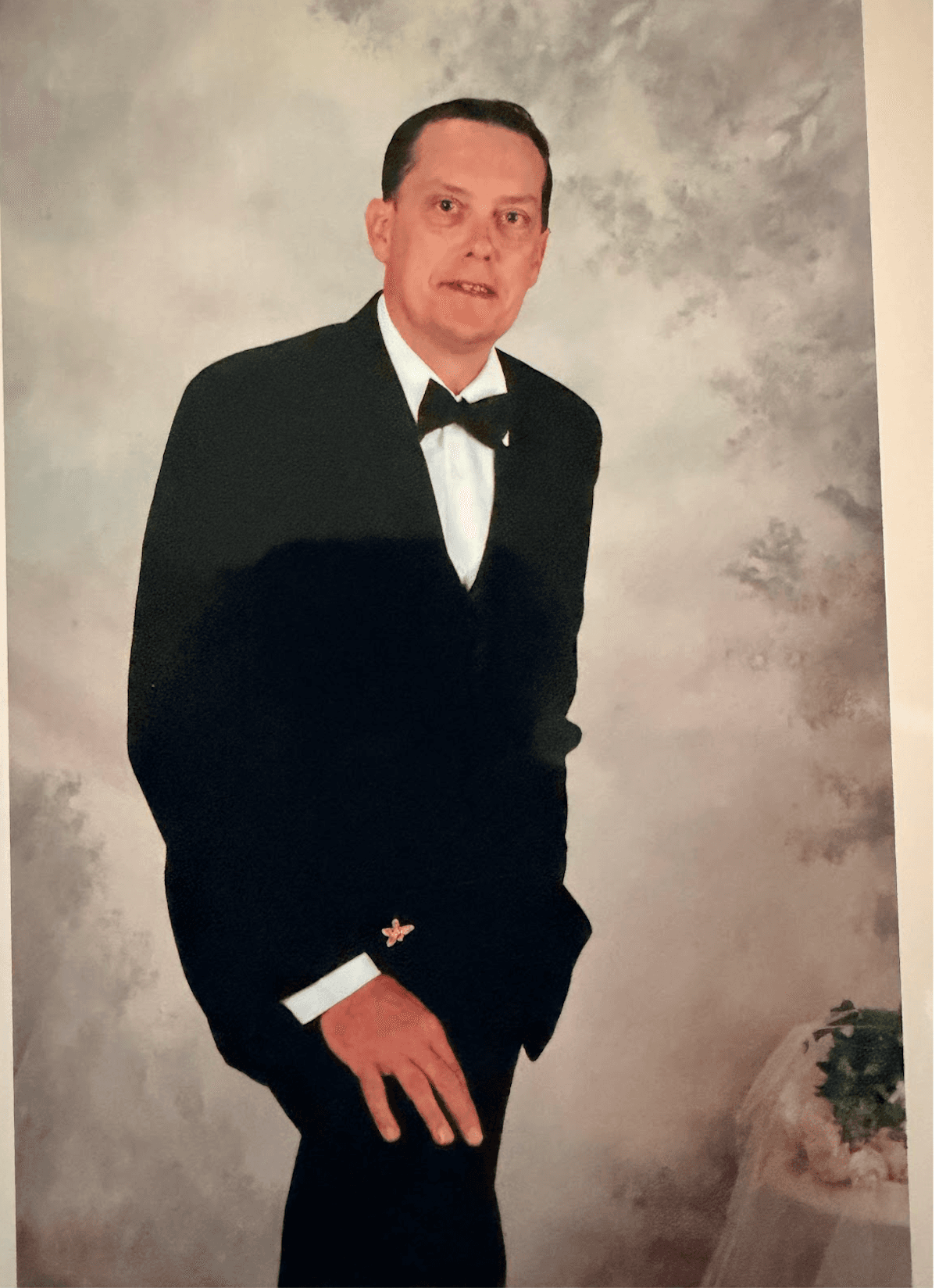 Formal portrait photo of Kerry Sheron in a tuxedo.